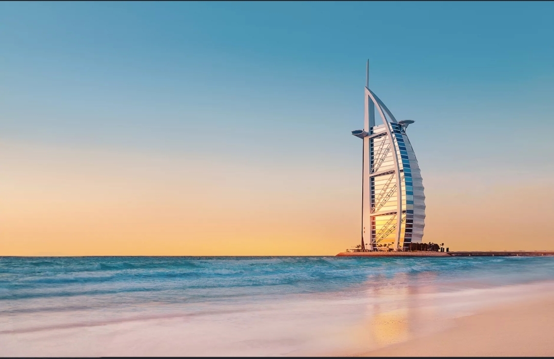 The Burj Al Arab on the Dubai shoreline at sunset